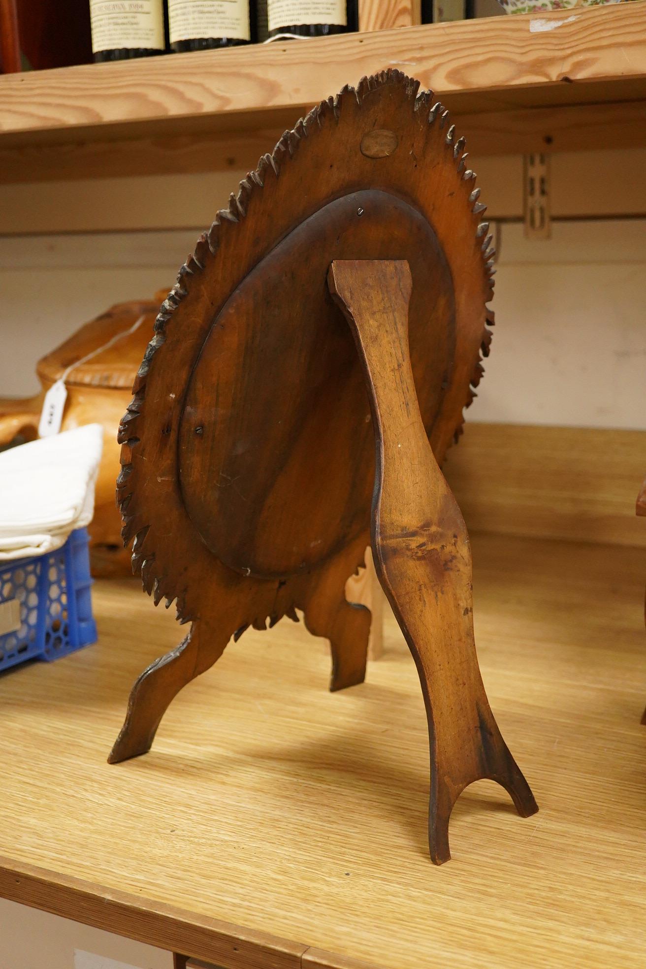 A dressing mirror, naturalistically designed with painted foliate decoration and branch effect legs, 42cm high